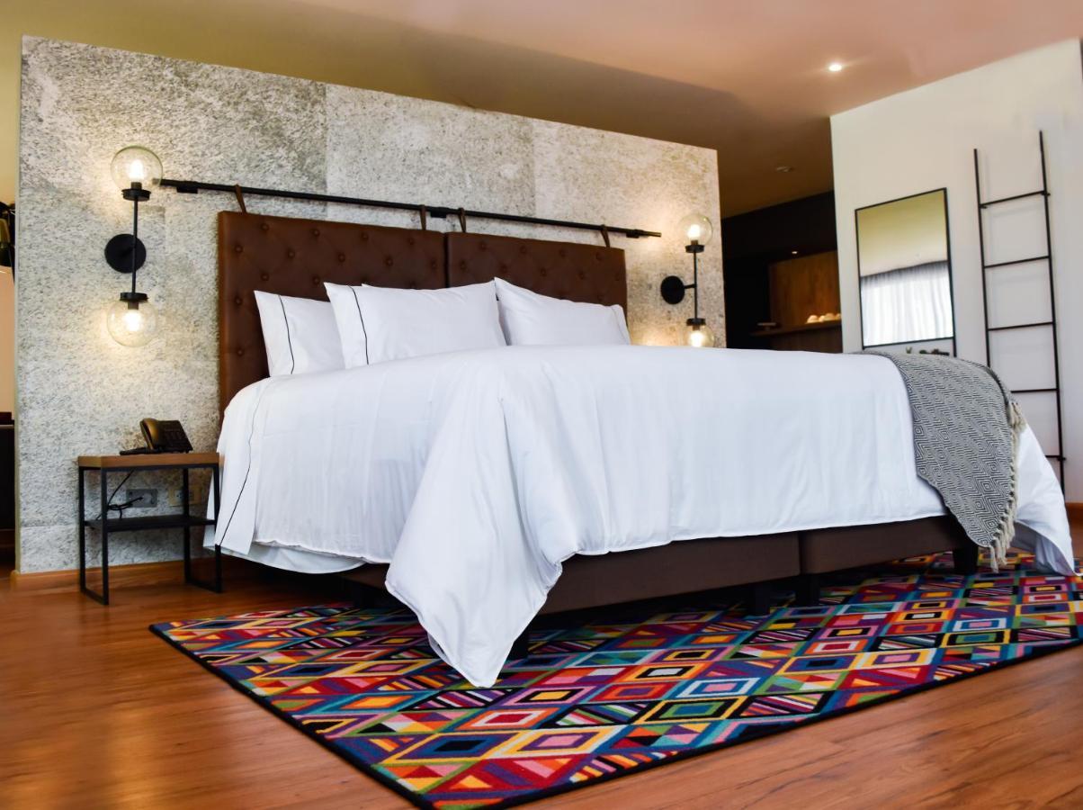 Hotel V1501 Pasto Dış mekan fotoğraf A bedroom with a carpet