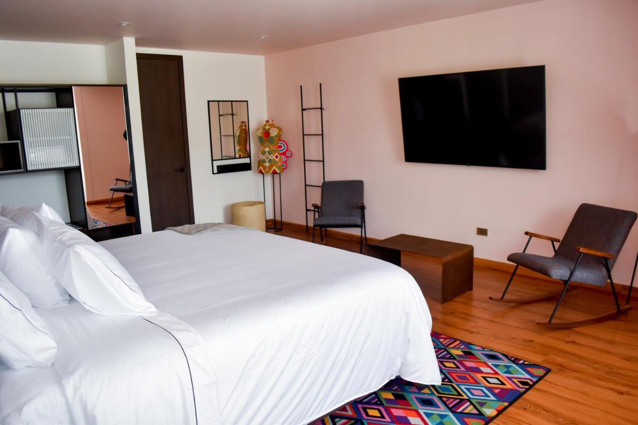 Hotel V1501 Pasto Dış mekan fotoğraf A room at the hotel